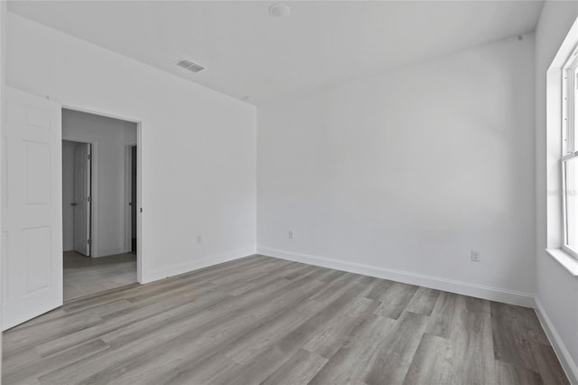 empty room with light wood-type flooring