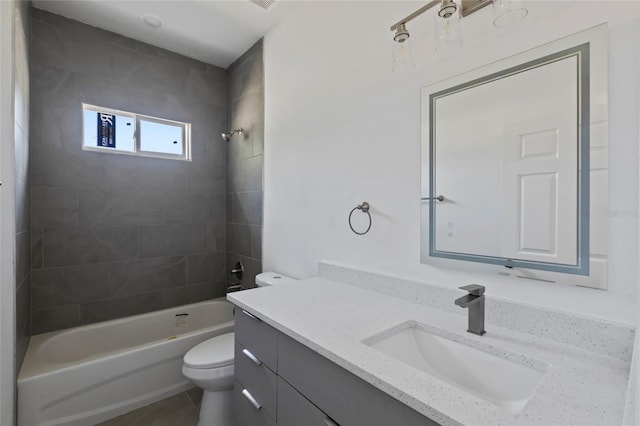 full bathroom featuring vanity, toilet, and tiled shower / bath