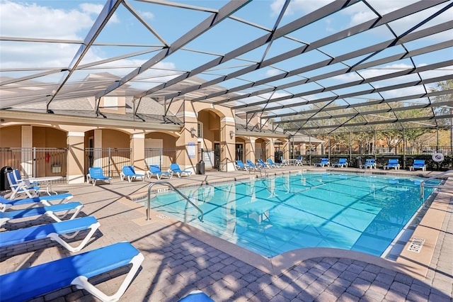 view of pool with a lanai and a patio