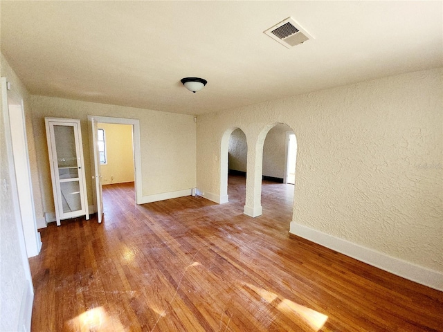 spare room featuring hardwood / wood-style floors