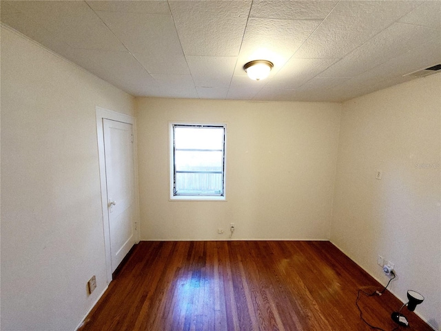 empty room featuring dark hardwood / wood-style floors