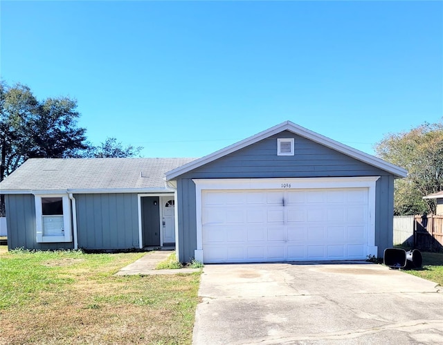 single story home with a front yard and a garage