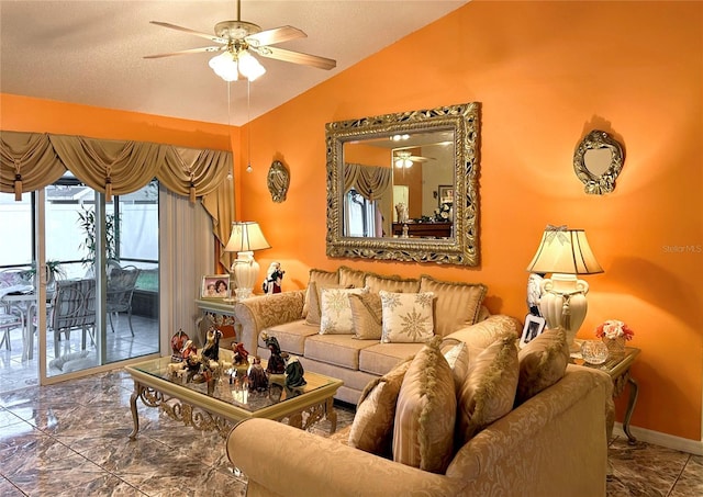 living room with ceiling fan and lofted ceiling