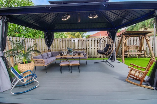 wooden deck featuring a gazebo and an outdoor living space