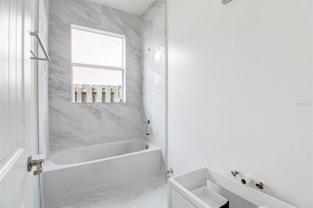 bathroom featuring tiled shower / bath combo