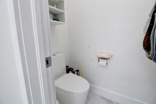 bathroom featuring toilet