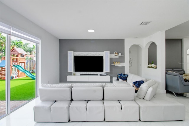 living room with light tile patterned floors