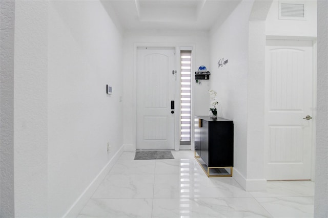 entrance foyer featuring plenty of natural light