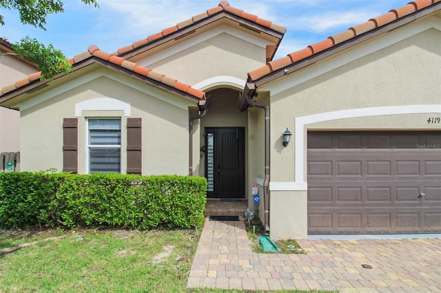 entrance to property featuring a garage