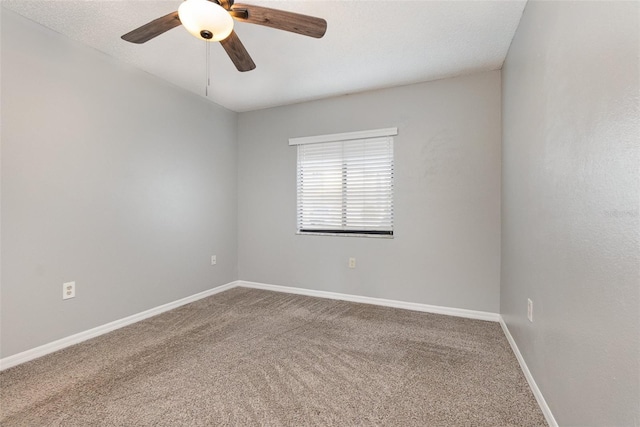 empty room with carpet floors and ceiling fan