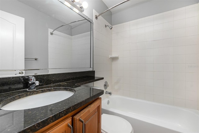 full bathroom featuring vanity, toilet, and tiled shower / bath combo