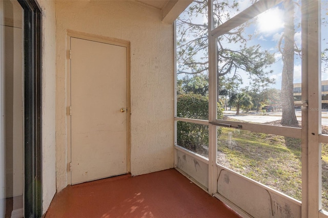 unfurnished sunroom featuring a healthy amount of sunlight