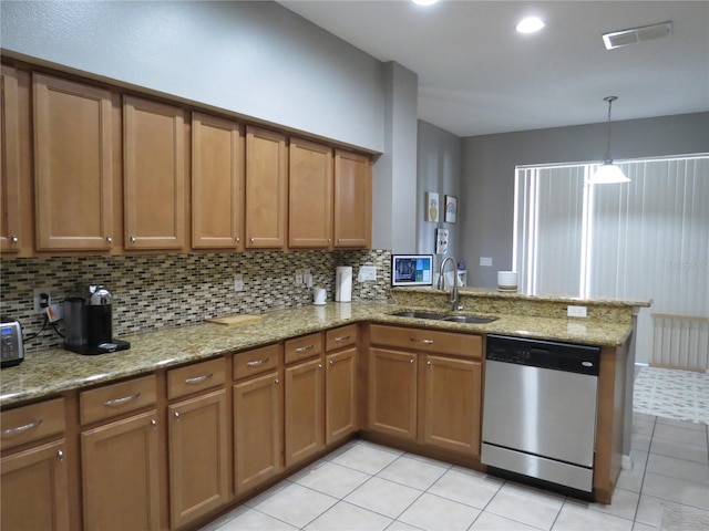 kitchen featuring dishwasher, sink, light tile patterned flooring, light stone counters, and kitchen peninsula