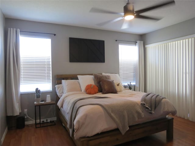 bedroom with ceiling fan and hardwood / wood-style flooring