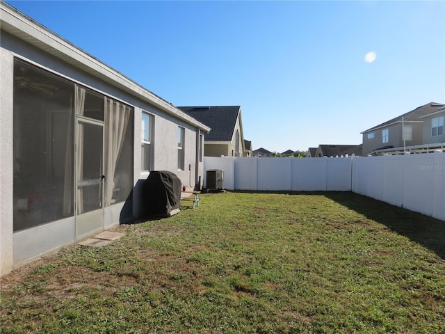 view of yard featuring central AC unit