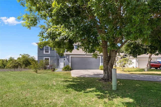 view of front of home with a garage and a front lawn