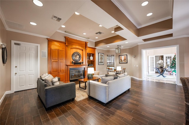 living room with dark hardwood / wood-style floors and ornamental molding