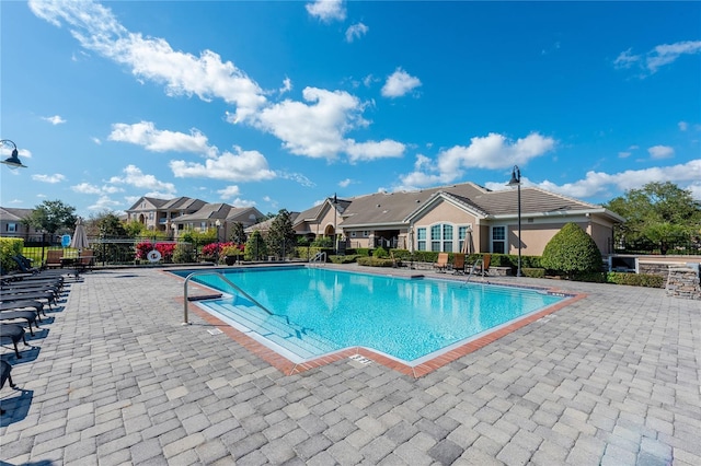 view of pool featuring a patio area