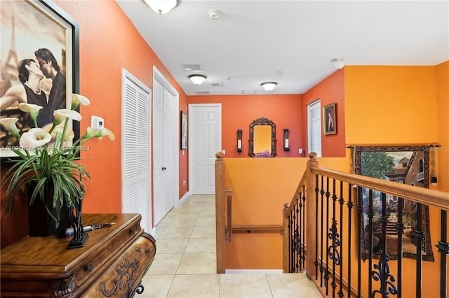 corridor featuring light tile patterned flooring