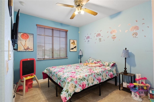 bedroom with ceiling fan and light tile patterned floors