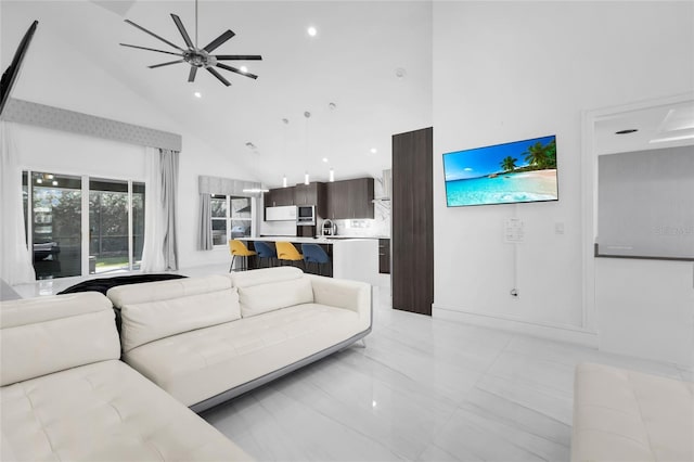 living room featuring high vaulted ceiling and ceiling fan