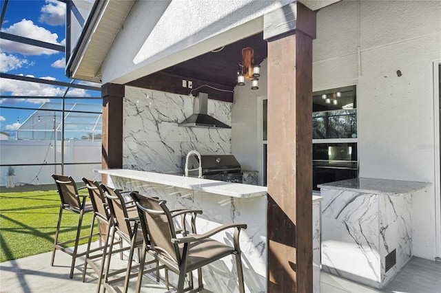 view of patio / terrace featuring area for grilling, a lanai, and exterior bar