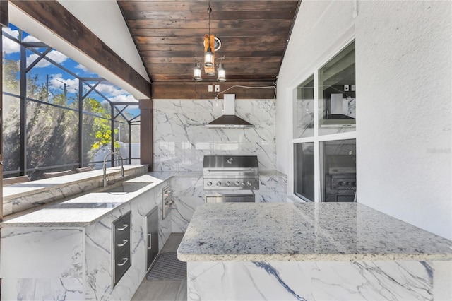 view of patio / terrace with an outdoor kitchen, a lanai, sink, and grilling area