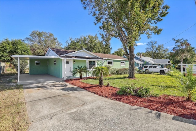 view of front facade featuring a carport and a front yard