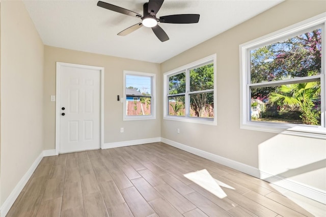 spare room with ceiling fan and light hardwood / wood-style flooring