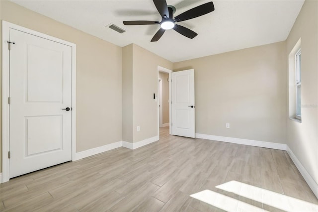 unfurnished bedroom featuring ceiling fan and light wood-type flooring