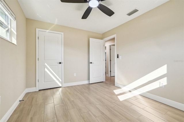 unfurnished bedroom featuring ceiling fan and light hardwood / wood-style flooring