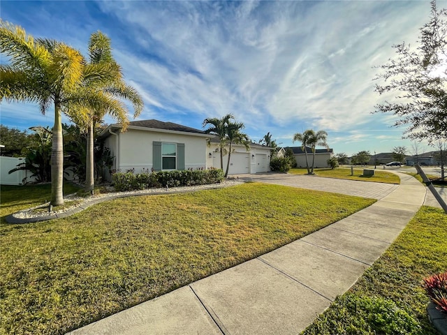 single story home featuring a front yard and a garage