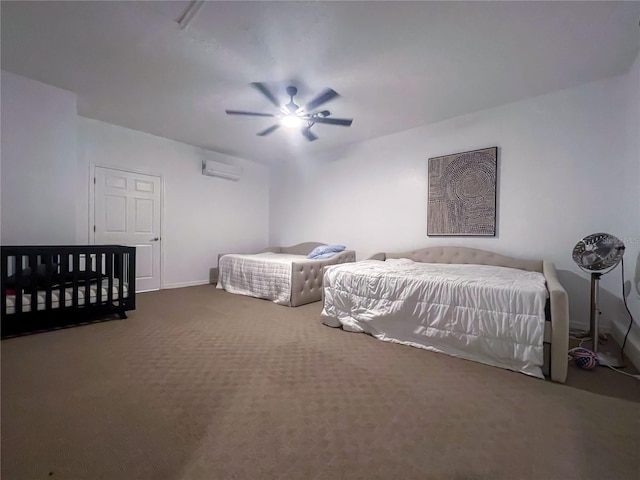 bedroom featuring carpet, a wall unit AC, and ceiling fan