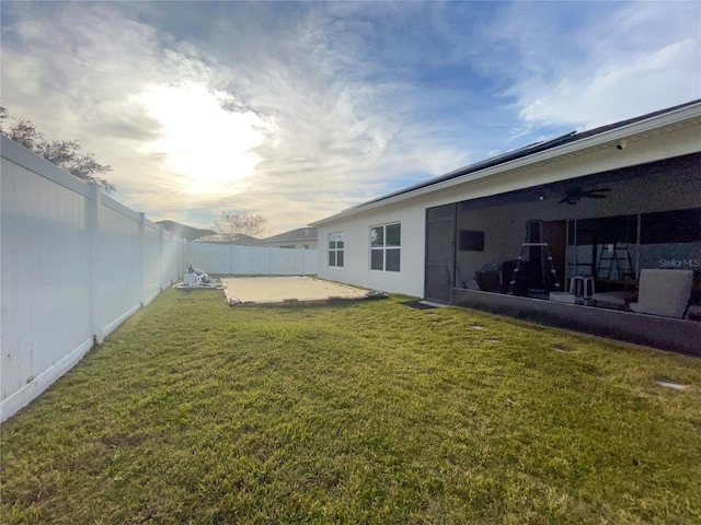 yard at dusk featuring a patio area