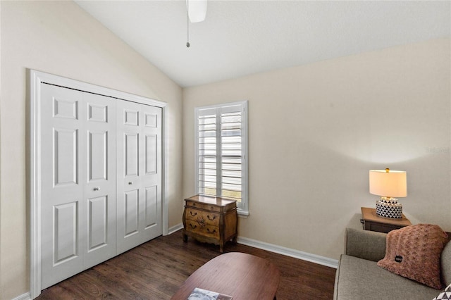 sitting room featuring vaulted ceiling, a healthy amount of sunlight, ceiling fan, and dark hardwood / wood-style flooring