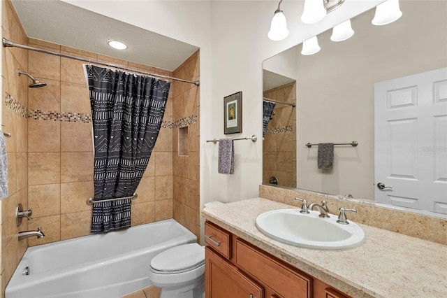 full bathroom featuring vanity, shower / bathtub combination with curtain, tile patterned floors, and toilet