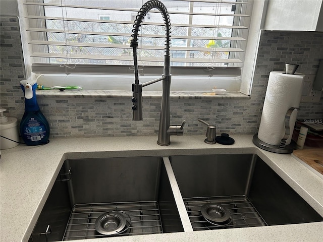 interior details with backsplash and sink