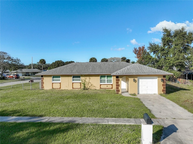 ranch-style home with a garage and a front lawn