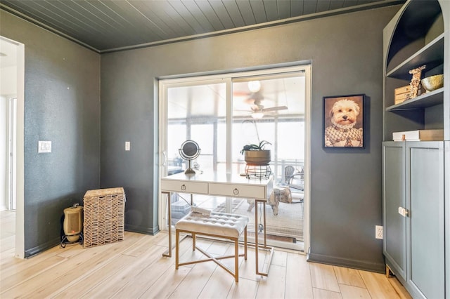 interior space with ceiling fan, light wood-type flooring, crown molding, and wooden ceiling