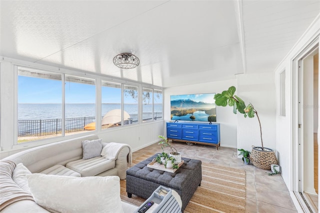 sunroom / solarium featuring a water view and a healthy amount of sunlight