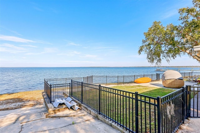 view of patio with a water view