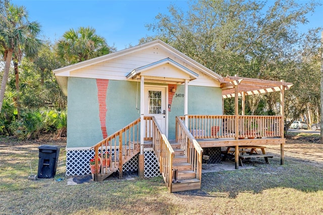 view of front of home with a pergola