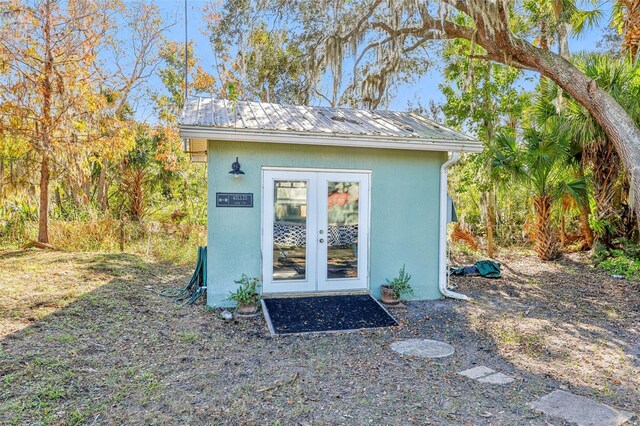 view of outbuilding featuring french doors