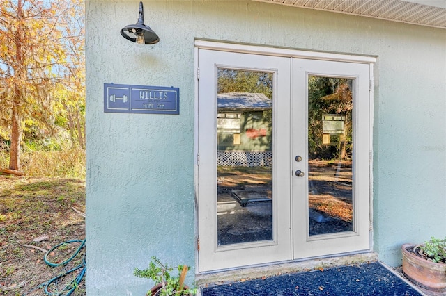 property entrance featuring french doors