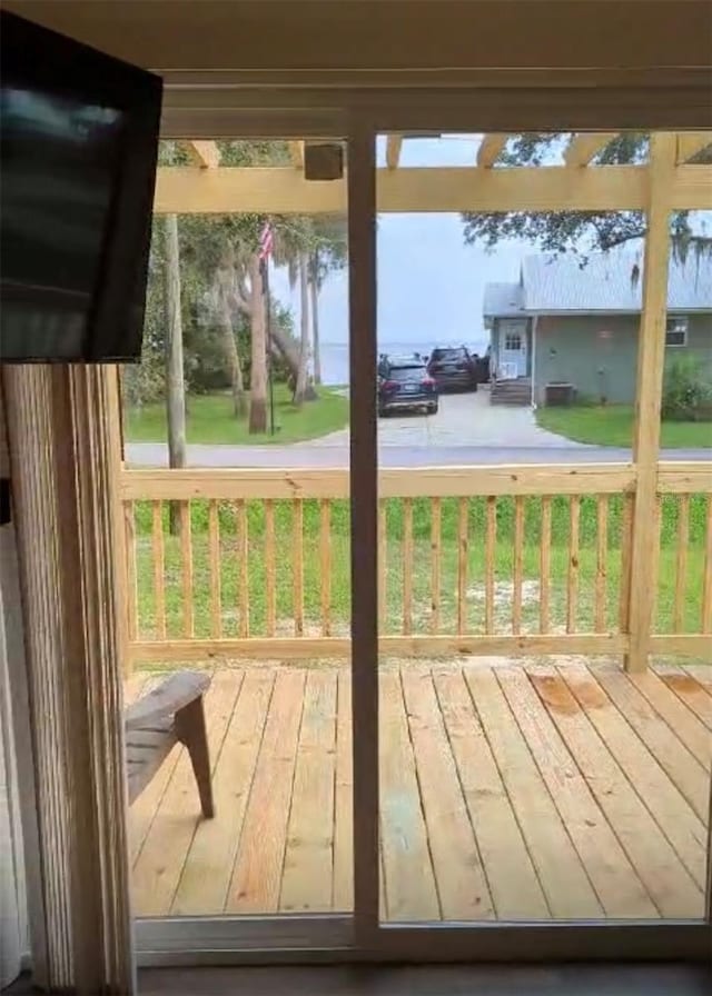 deck featuring a yard and a water view