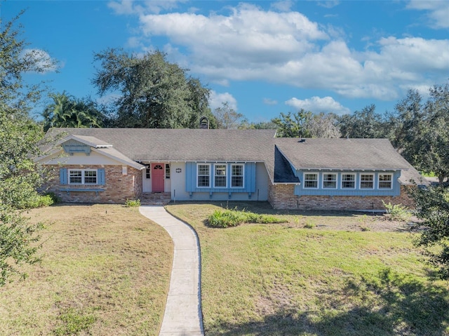 ranch-style home with a front lawn