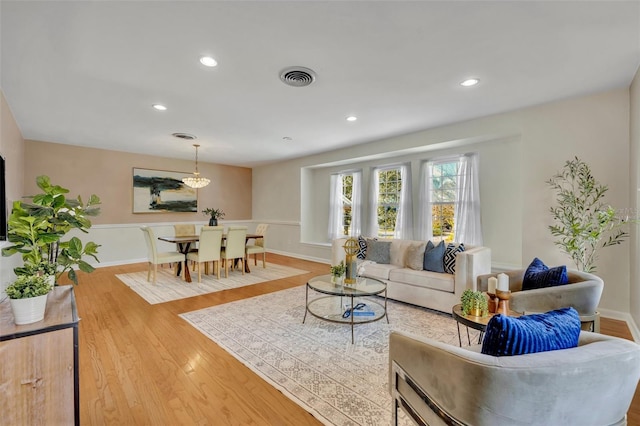 living room with light hardwood / wood-style floors