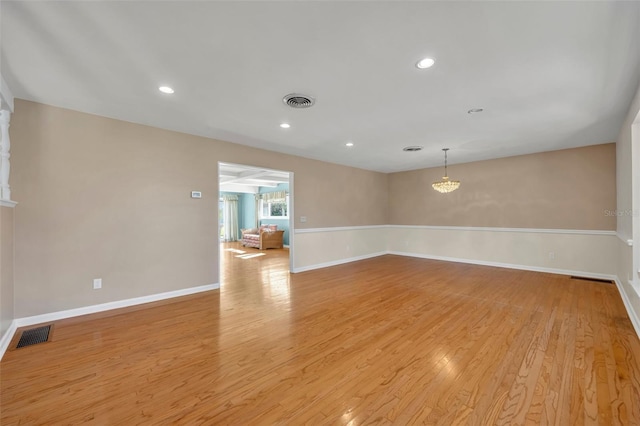 empty room with light hardwood / wood-style floors