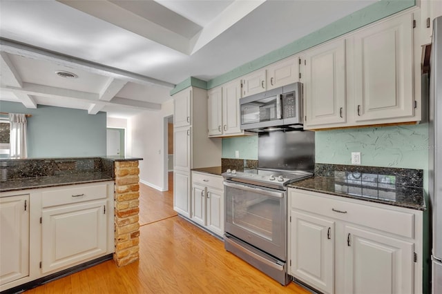 kitchen featuring beam ceiling, coffered ceiling, light hardwood / wood-style floors, white cabinets, and appliances with stainless steel finishes