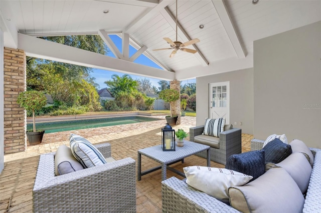 view of patio / terrace with ceiling fan and an outdoor living space